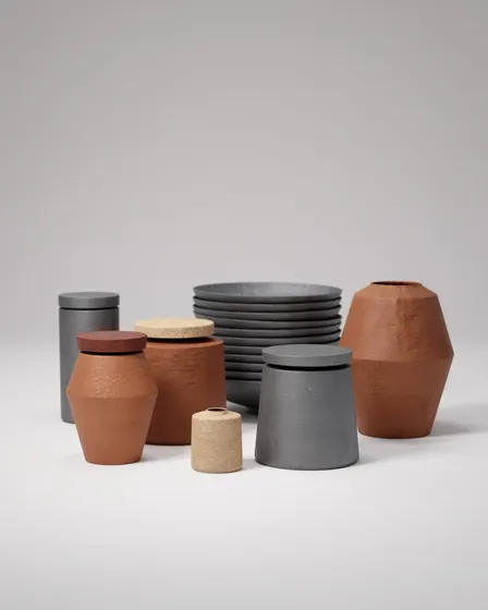 Terracotta vessels and charcoal bowls arranged in a minimalist still life